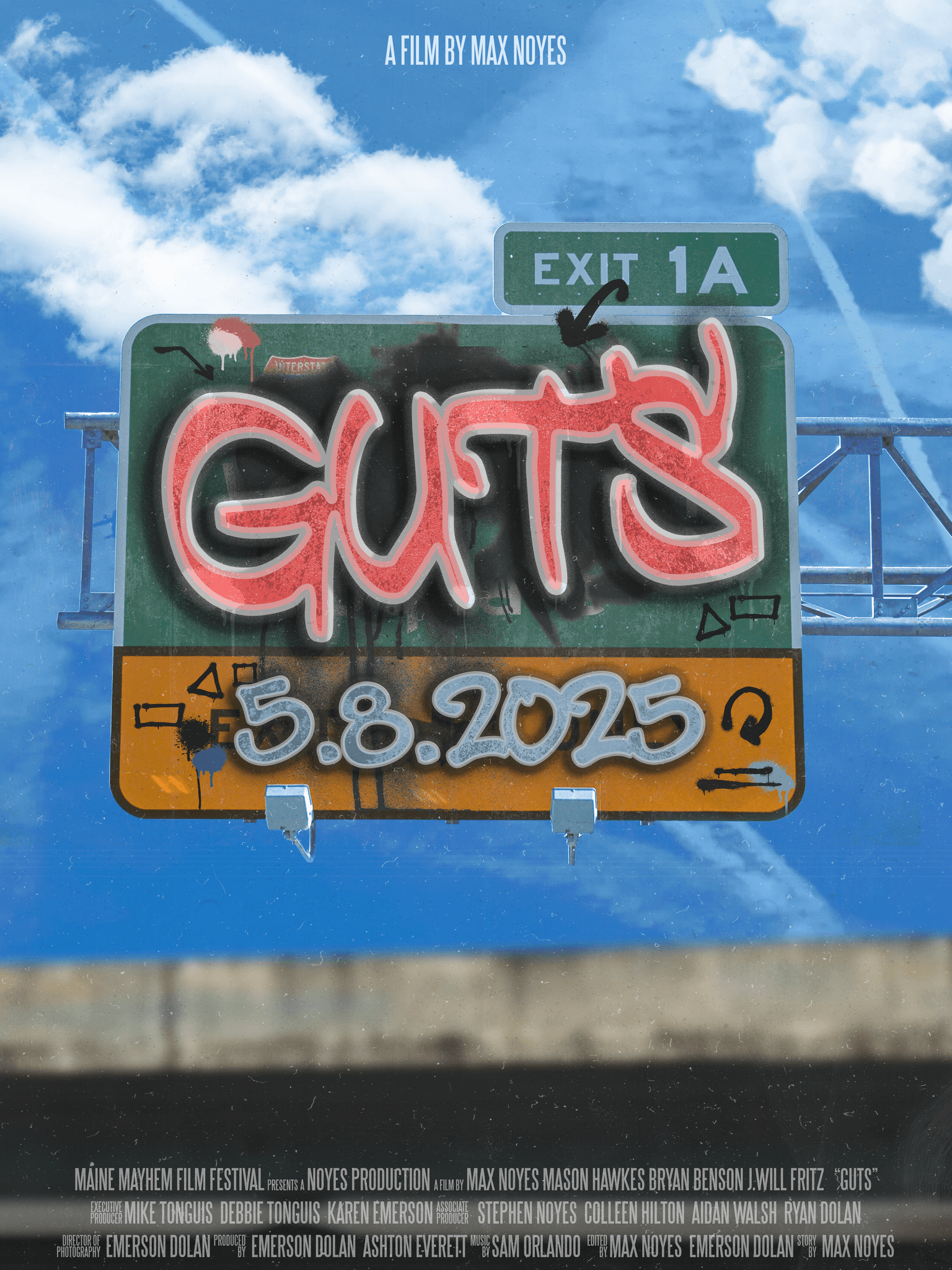 Graffiti lettering and road-sign imagery beneath an open blue sky.
